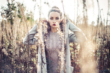 Wall Mural - Fashion beautiful lady in autumn landscape