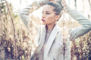 Wall Mural - Fashion beautiful lady in autumn landscape