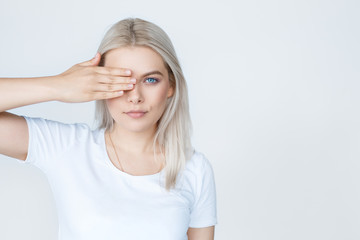 Blonde teenage female looking at camera