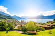 Landscape view on Weggis village on Lucerne lake with beautiful mountains on the background in Switzerland