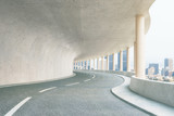 Fototapeta Perspektywa 3d - Concrete tunnel with city view