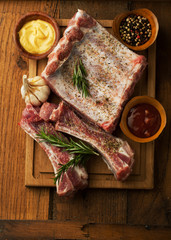 Canvas Print - Raw Pork ribs with herbs, spices, and rosemary