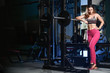 © antondotsenko - Beautiful fitness woman trains in the gym.