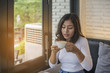 © sunti - Beautiful young woman with morning coffee