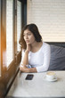 © sunti - Beautiful young woman with morning coffee