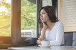 © sunti - Beautiful young woman with morning coffee