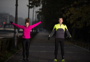 couple warming up before jogging