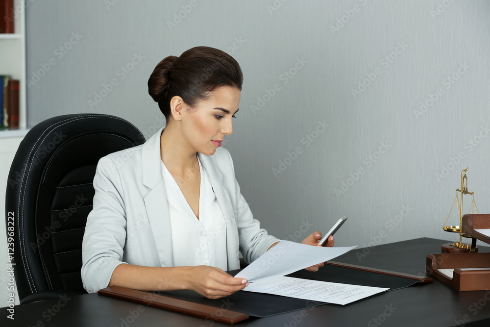 Beautiful young woman working in modern office