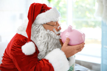 Sticker - Santa Claus with piggy bank at home