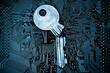 A broken key on computer circuitboard background / computer security breach concept