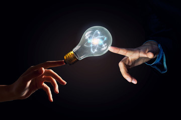 Wall Mural - hand pointing light bulb . mixed media