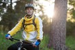 © WavebreakMediaMicro - Male biker with mountain bike in forest
