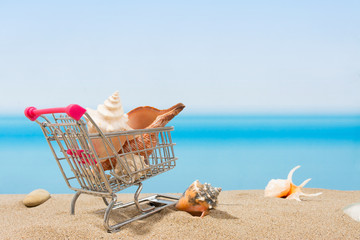 Wall Mural - Summer signings, shopping travel. Cart on the beach