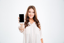 Smiling Woman Showing Blank Smartphone Screen Isolated On White Background