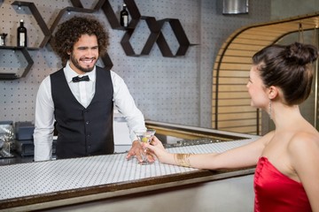 Wall Mural - Waiter interacting with beautiful woman