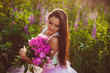© pyrozenko13 - beautiful brunette holds a large bouquet of flowers