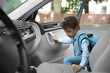 © Africa Studio - Taking pupil after school. Boy getting in car