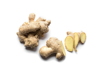 Wall Mural - Cut and whole fresh ginger isolated on white