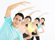 © Tom Wang - smiling young fit group stretching in gym