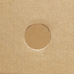 Brown paper box with a hole circle