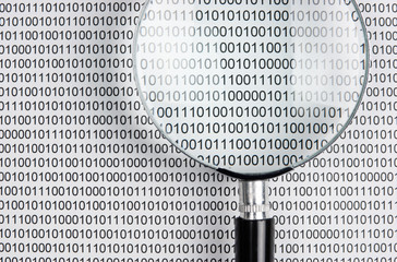 magnifying glass on a binary code