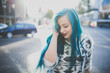 © ADDICTIVE STOCK - Young girl with blue hair.