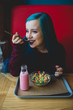 © ADDICTIVE STOCK - Blue haired girl eating multicolored cereal