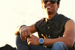 © kegfire - young Man wearing round smartwatch.