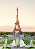 Fototapeta Paryż - Eiffel Tower shot from Trocadero at sunset. Pond and gardens on