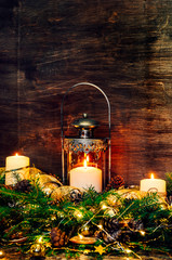 Wall Mural - Vintage old metal lamp.Fir branches, Christmas candles, ornaments and decorations. New year.