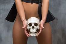 Sexy Woman Holding Skull