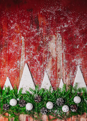 Wall Mural - New year's background. Handmade white Christmas tree. Red rustic wood background.Real fir branches, vintage ornaments.