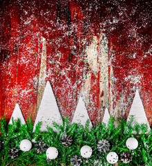 Wall Mural - New year's background. Handmade white Christmas tree. Red rustic wood background, white falling snow.Real fir branches, vintage ornaments.