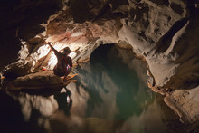 A Filipino Tour Guide Holds A Lantern Inside Sumaging Cave Or Big Cave Near Sagada; Luzon, Philippines