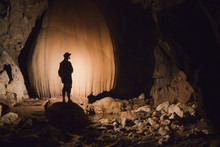 A Filipino Tour Guide Holds A Lantern Inside Sumaging Cave Or Big Cave Near Sagada; Luzon, Philippines
