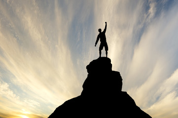 Wall Mural - Man on top of mountain.