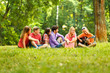 © yurolaitsalbert - group of students with a guitar resting in the Park