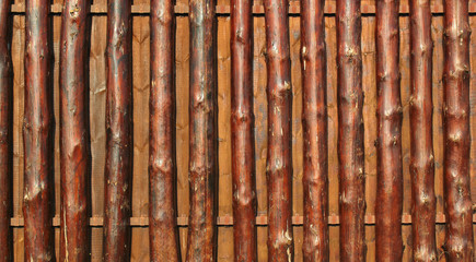 Wall Mural - Wooden fence of oak tree trunks