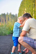 © kazakova0684 - the father and the little son walk on a forest footpath. The fat