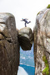 © lkoimages - Young man hiking on kjerag. Happy  enjoy beautiful lake and good weather in Norway.