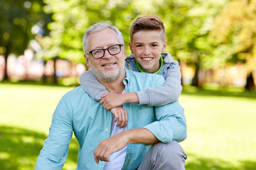 Poster - grandfather and grandson hugging at summer park