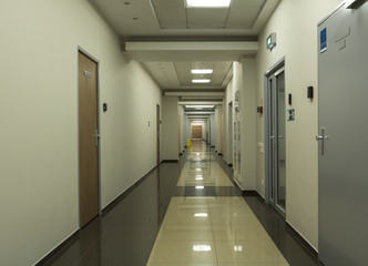  Empty long office corridor