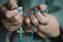 Rosary Beads In Hand