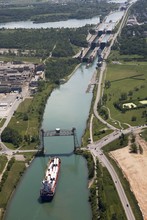 Welland Canal With A Ship, Bridge And Locks; Thorold, Ontario, Canada
