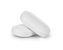 Close-up Of Two Pills Isolated On White Background