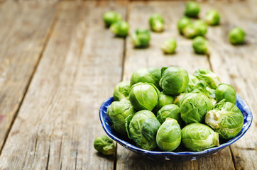 Wall Mural - Brussels sprouts in a wooden bowl