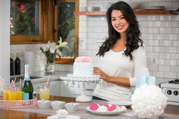 Wall Mural - Portrait of a beautiful woman with cake stand cookies and other treats