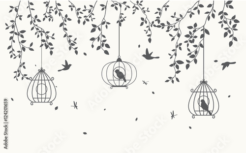 Naklejka dekoracyjna Klatki ptaków opuszczone na liściach