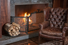 Leather Armchair And Fireplace