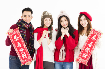 young asian group showing Spring festival couplets.